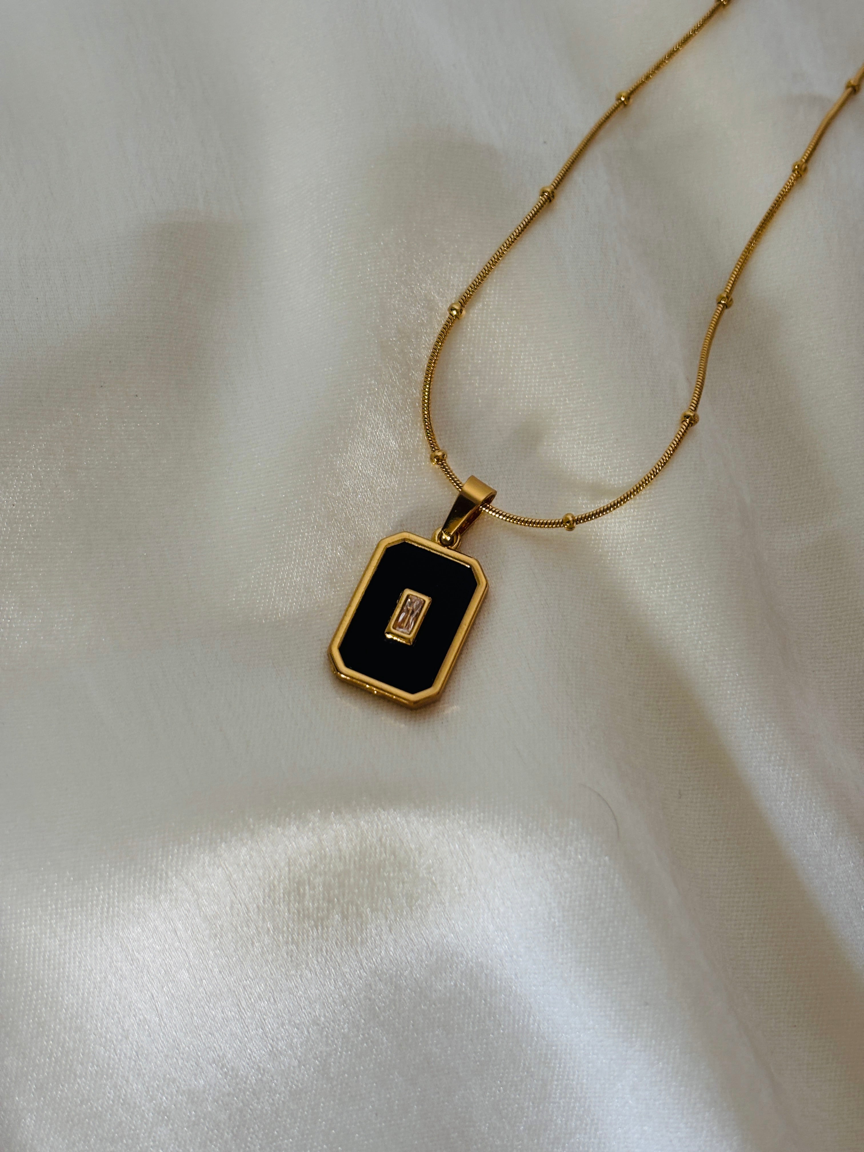 Black enamel charm necklace