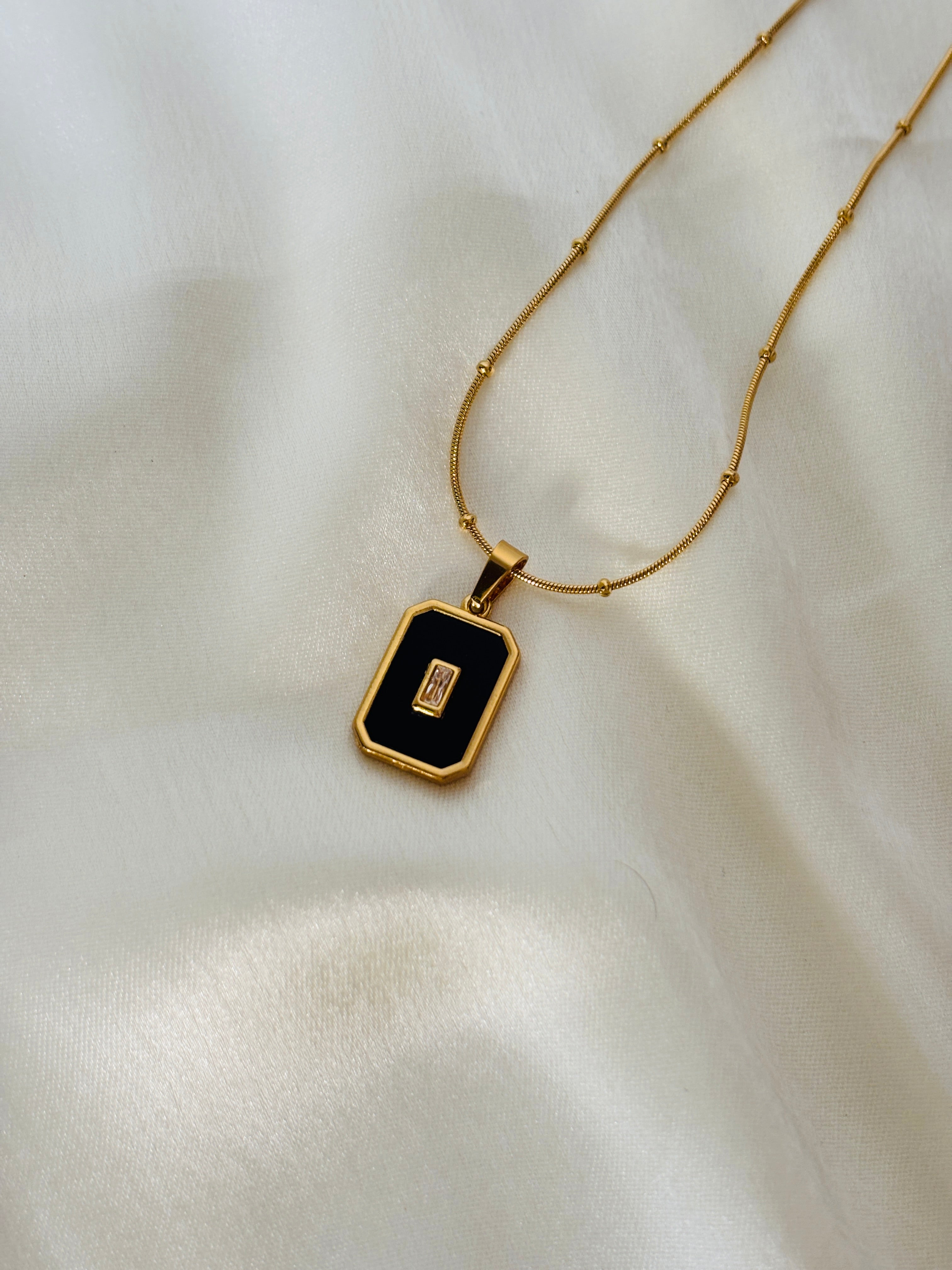 Black enamel charm necklace