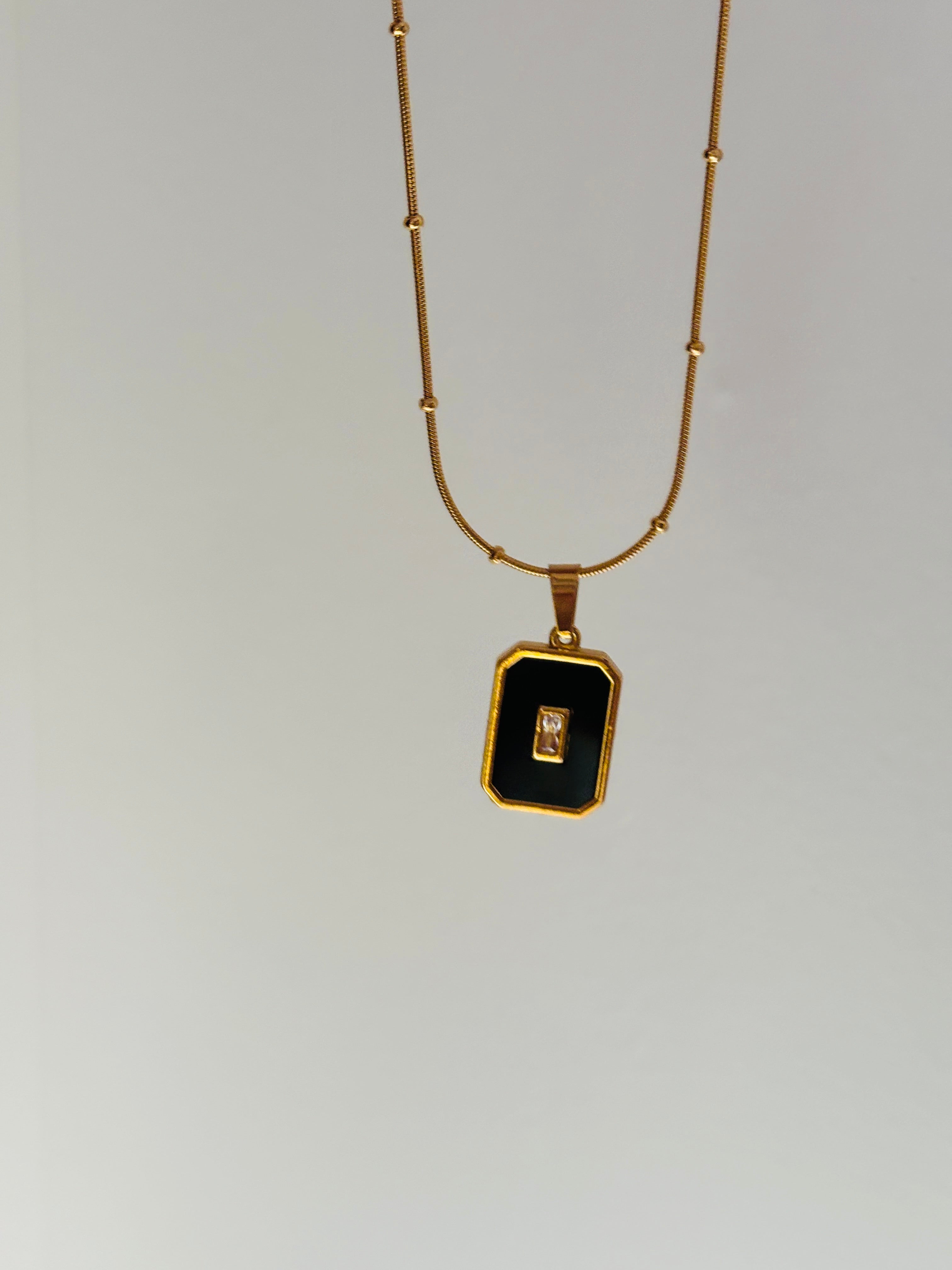 Black enamel charm necklace